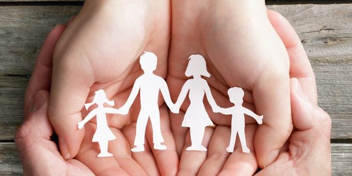 supporting families paper cut out of familes in a hand 1438×3444 website paper cut out of people held in a hand supporting families after suicide