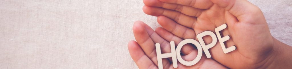 hands with the words hope held within it to signify hope after suicide