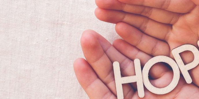 hands with the words hope held within it to signify hope after suicide