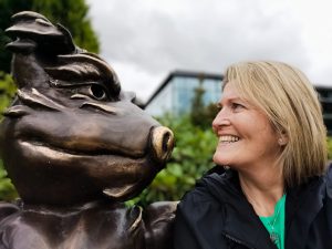 Sheila Stapleton HUGG Telephone Support Lead looking at a sculpture