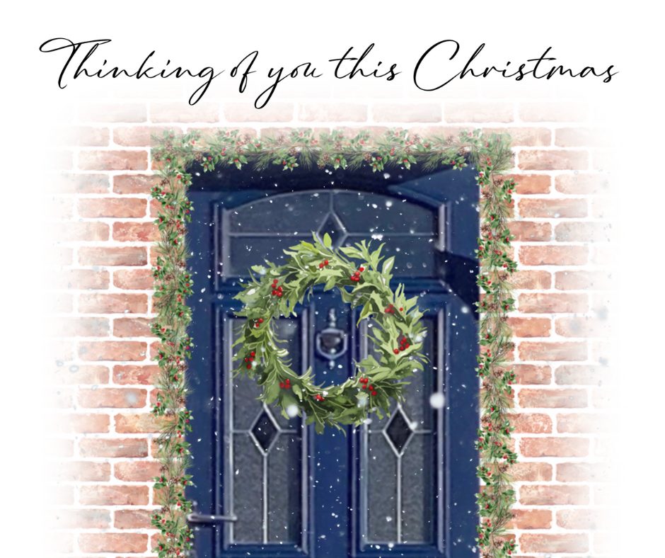 Blue door with christmas wreath and the words thinking of you this christmas above the door. robin outside the door.