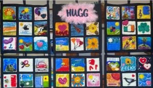 Fabric quilt made up of individual hand-crafted squares in remembrance of people who died by suicide