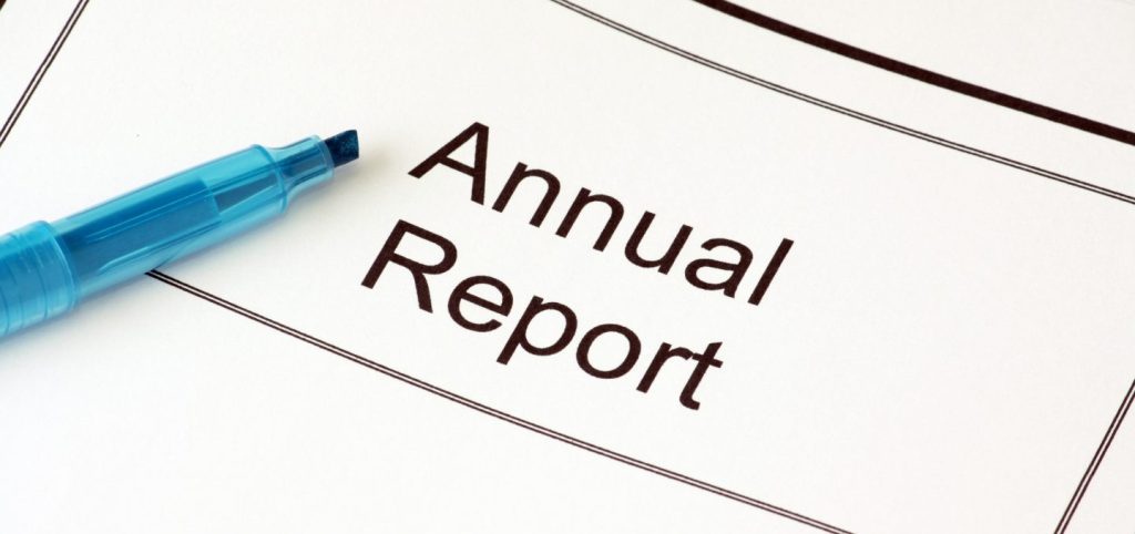 image of a highlighter and paper saying annual report
